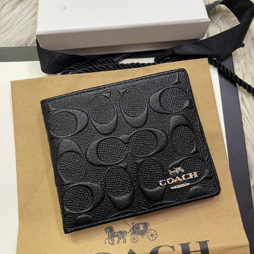 Coach Black Men's Wallet with Embossed Logo Pattern and Metallic Brand Emblem